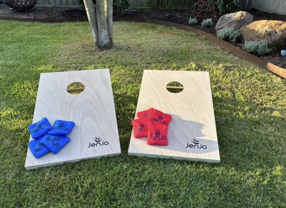 Cornhole boards and bean bags set up outdoors