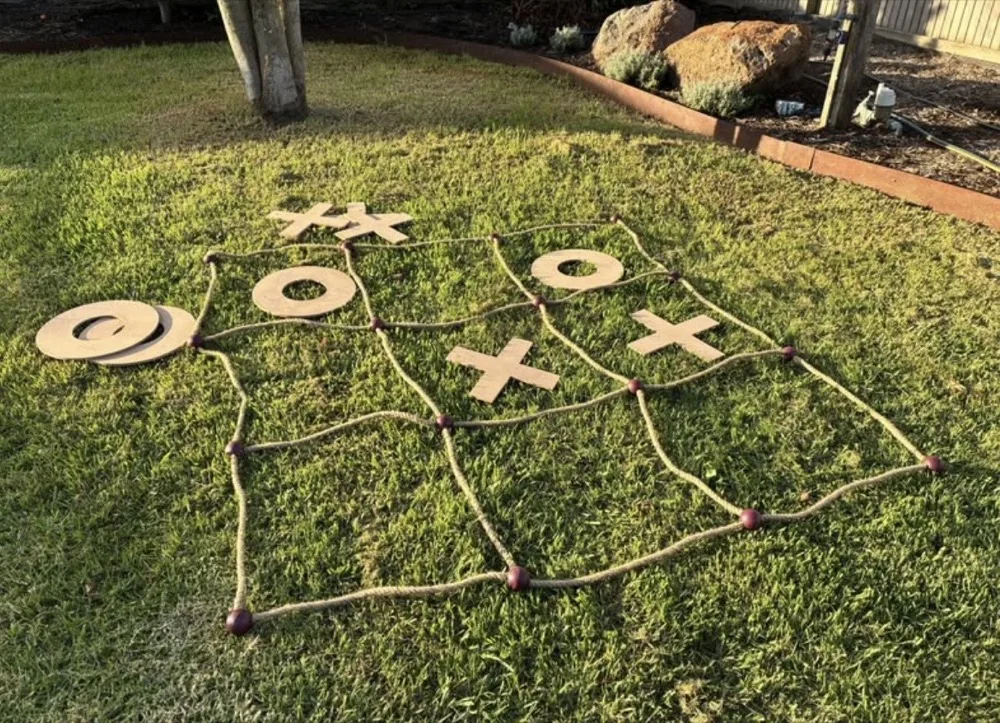 Giant noughts and crosses game on a lawn