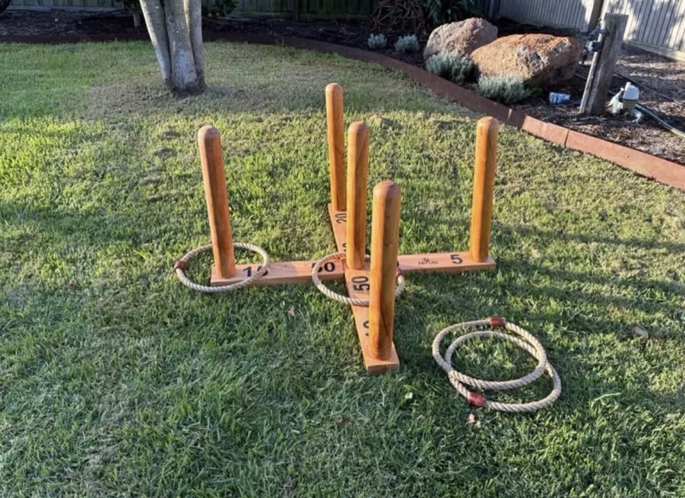 Wooden quoits ring toss game set up outdoors